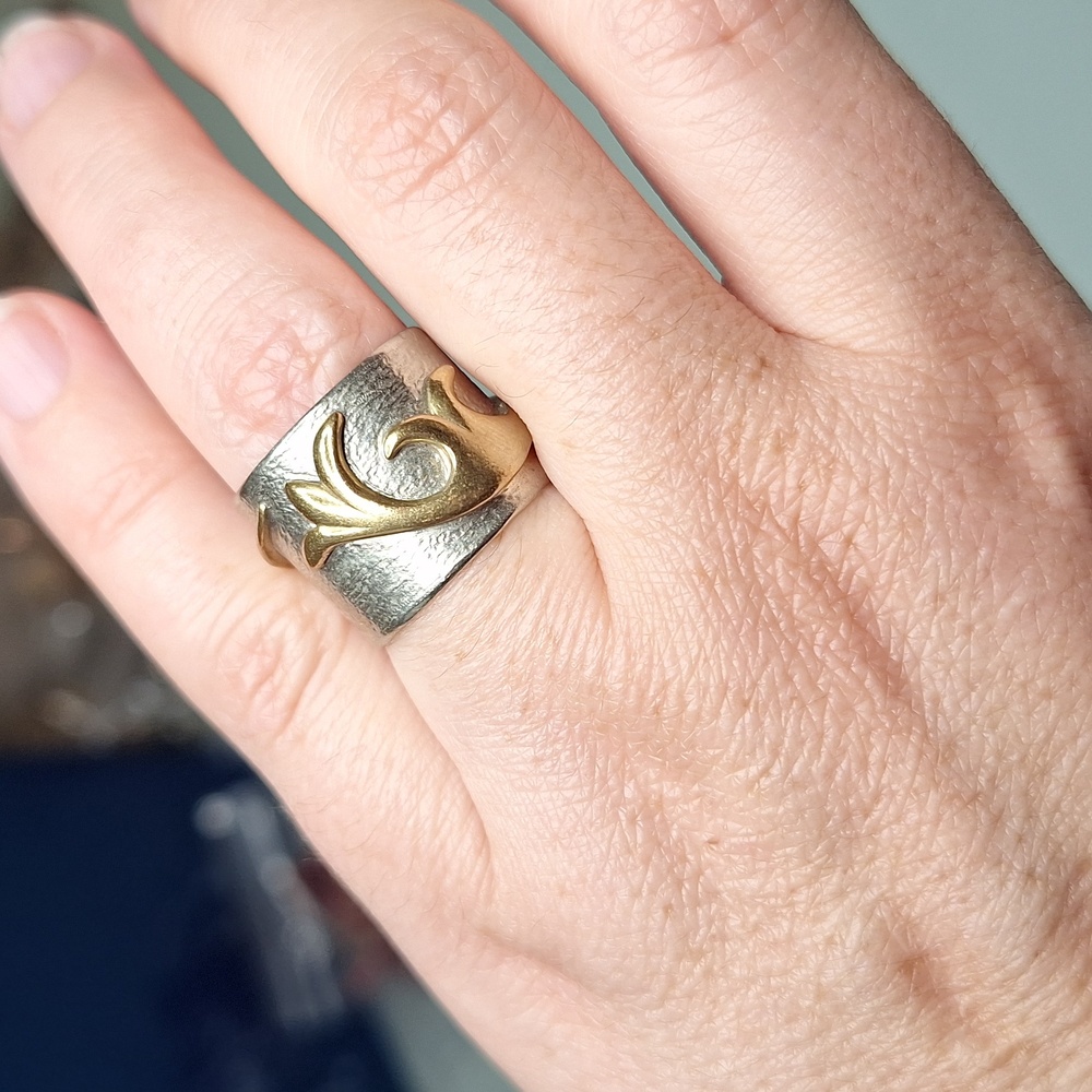 Elegant Silver and Gold Swirl Ring